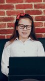 Online video call with teacher. distance learning. schoolgirl is having online lesson, video call, conversation with teacher, using laptop. studying online at home. - Powered by Shutterstock - Get 15% off with code: PIKWIZARD15