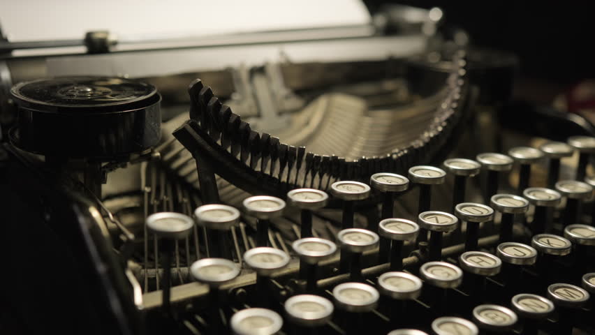 View of old vintage typewriter with keyboard rotating close up