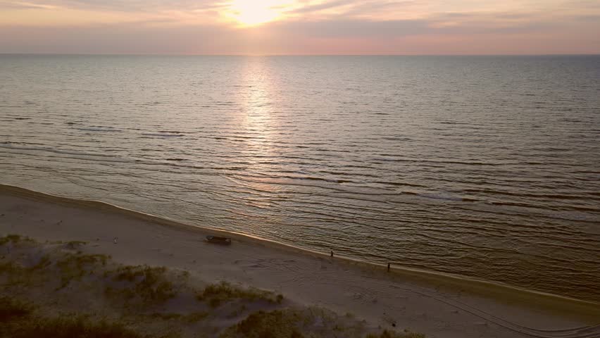 Baltic Sea sunset over sandy beach