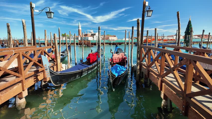 Venetian gondolas overlooking the island of San Giorgio Maggiore and Giudecca, Italy
