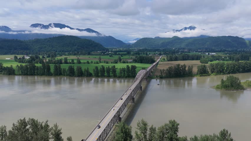 Aerial View of Fraser River Bridge, Connecting Scenic Landscapes in British Columbia, Canada