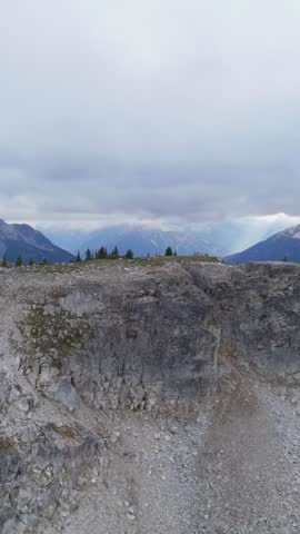 Majestic Mountain Landscape in British Columbia, Canada with Rocky Peaks and Cloudy Sky
