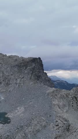 Majestic Rocky Mountain Landscape Under Cloudy Skies in British Columbia, Canada