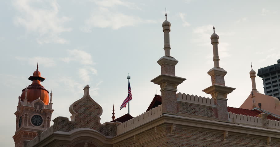 Historic Sultan Abdul Samad Building with the Malaysian flag waving in Kuala Lumpur.