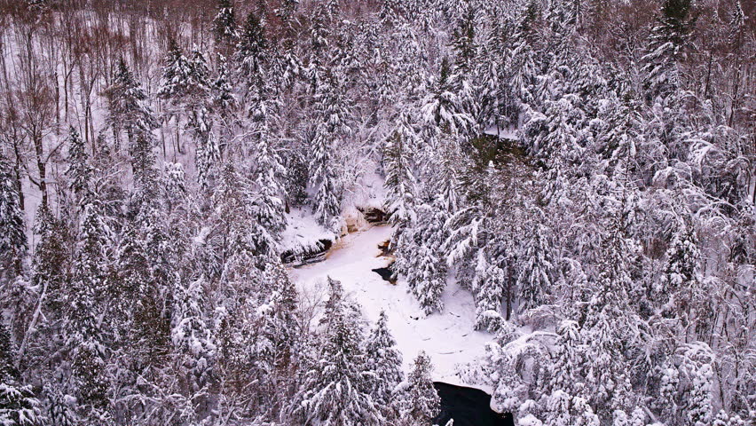 Top-down view of Canyon Falls during winter in Michigan