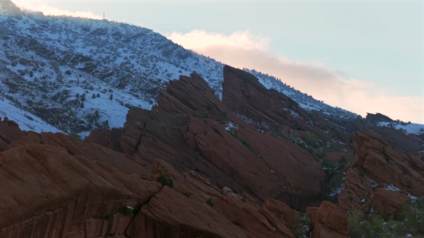 Winter on the Rocks sunset Winter Spring fresh snow on Red sandstone rock features Morrison Colorado aerial drone Red Rocks Park and Amphitheater Creation Rock Ship Rock Landmark concert event circle
