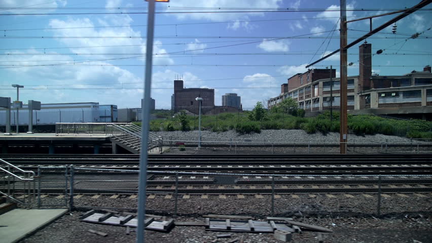 Looking out the window of a train or subway at the New Jersey landscape.