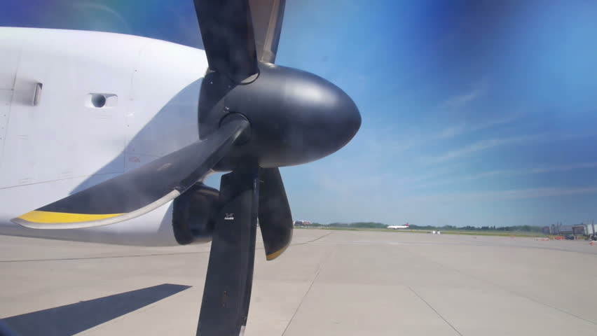 The propellers of an airplane power up.