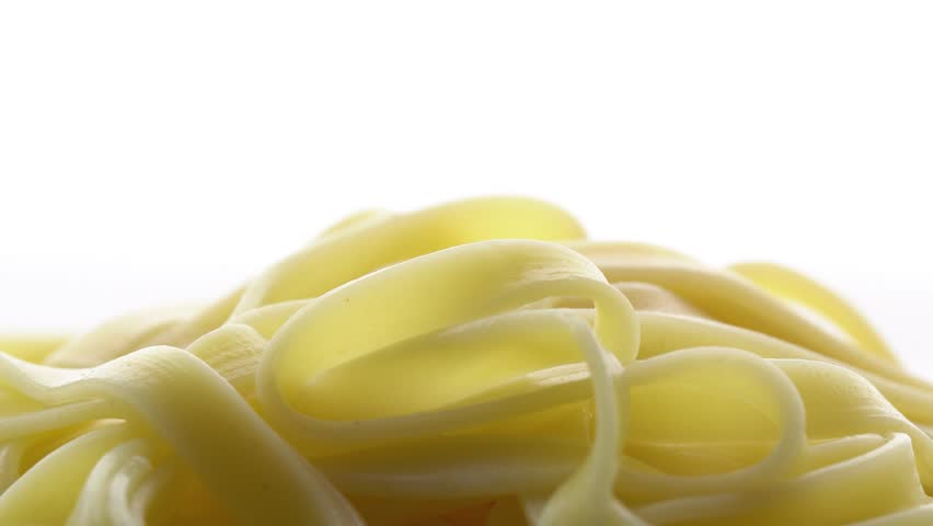 Tomato sauce is added to pasta on a white background, spaghetti and ketchup