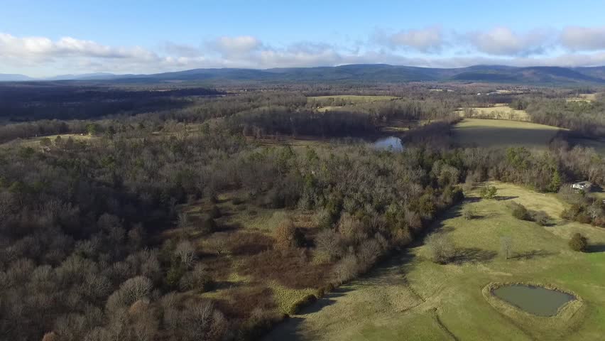 A descending view of a mountain valley in the early winter