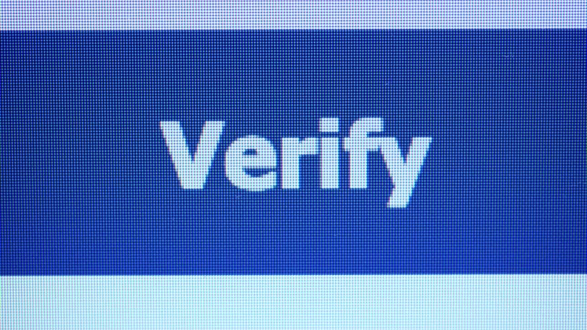 A computer mouse cursor approaches a large blue button with the text "Verify" displayed on a digital screen.