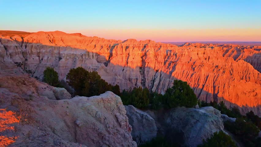Scenic aerial view of colorful sunset over Badlands National Park from the Pinnacles viewpoint, South Dakota