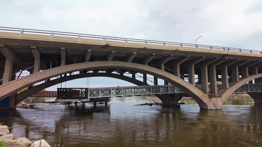 Scenic view of a city bridge crossing the Rock River through the urban landscape of Rockford Illinois
