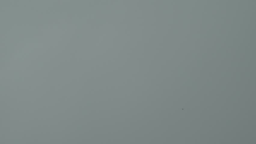 Rain and thunderstorm in the city. 
Shot from a house window. The raindrops hitting the window visor are clearly audible.
