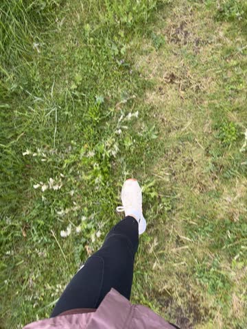 POV trail running through coastal forest with scenic sea view