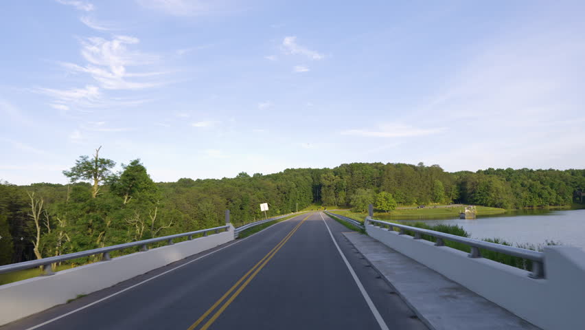Blue Ridge Parkway road trip. Driving car from personal perspective on exploration travel in summer forest on Appalachian mountain hills in North Carolina. Summertime landscape of beautiful nature