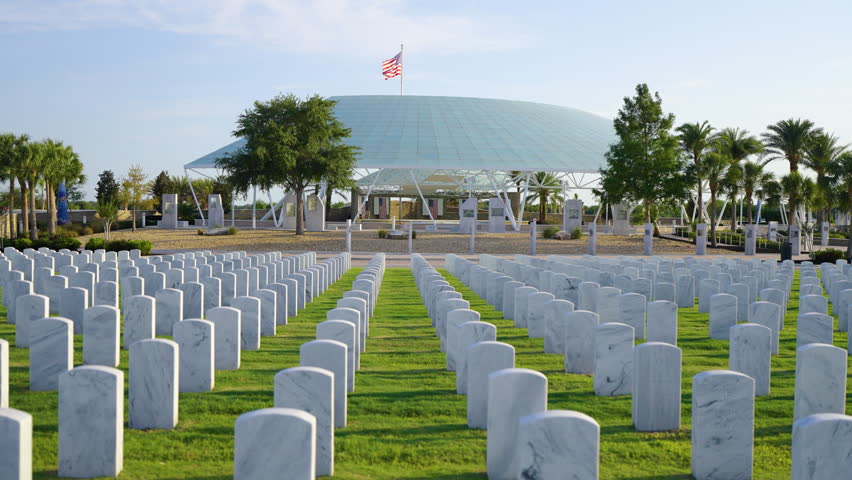 Army veteran cemetery with white headstones. Tombs of retired military soldiers. Memorial Day concept.