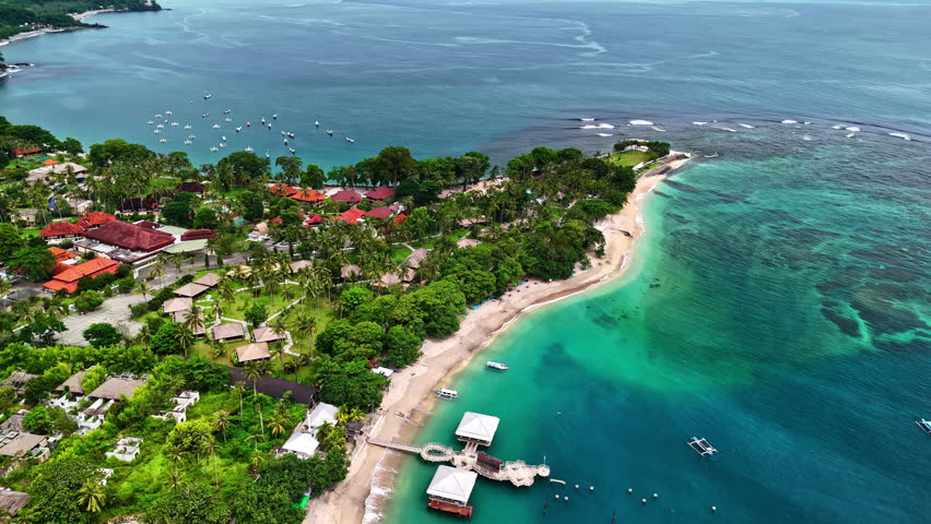 Senggigi beach on Lombok island with its vibrant turquoise ocean in Indonesia