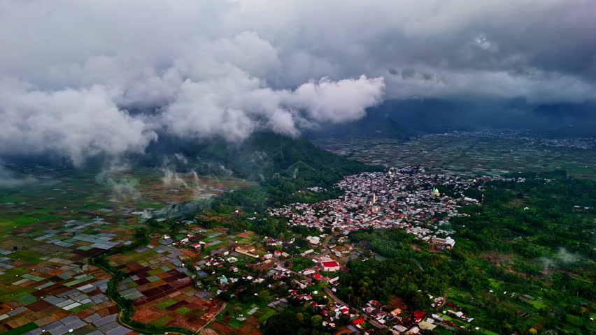 Bukit Selong rice fields and Sembalun Lawang, Indonesia village from above on a cloudy day