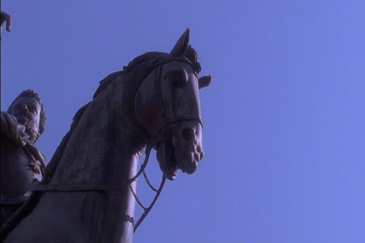  Slow pan to low angle of the equestrian Cosimo Medici statue on the Piazza della Signoria in Florence, Italy.