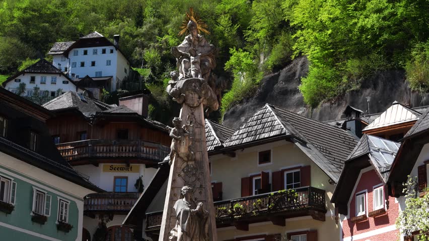 Baroque-style monument or statue in village square in Hallstatt, Austria.