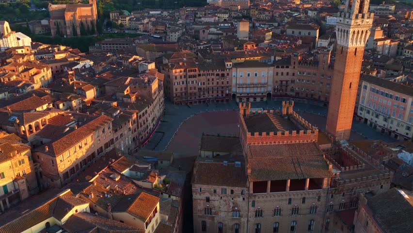 Siena skyline in the morning light, sunrise drone view of Siena in Tuscany, Italy, travel in Italy, tuscan medieval historic city of Siena, establishing shot