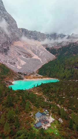 Stunning aerial view of Lago di Sorapis lake with turquoise water in the Dolomites mountain range near Cortina dAmpezzo, Belluno. Popular summer vacation destination in the Italian Alps, Italy.