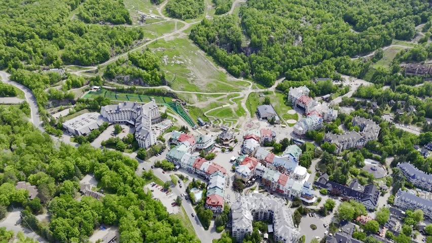 Aerial view of Mont Tremblant resort village, Quebec, Canada with lake, forest and mountain landscape in summer. g.