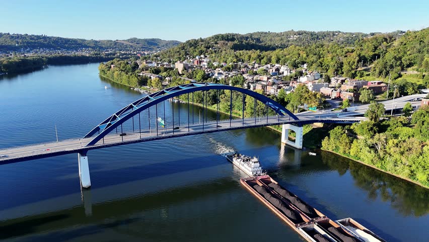 Aerial view of scenic tranquil Ohio River View With Blue Fort Henry Bridge Over Calm Water In A Hilly Wheeling Town West Virginia Landscape