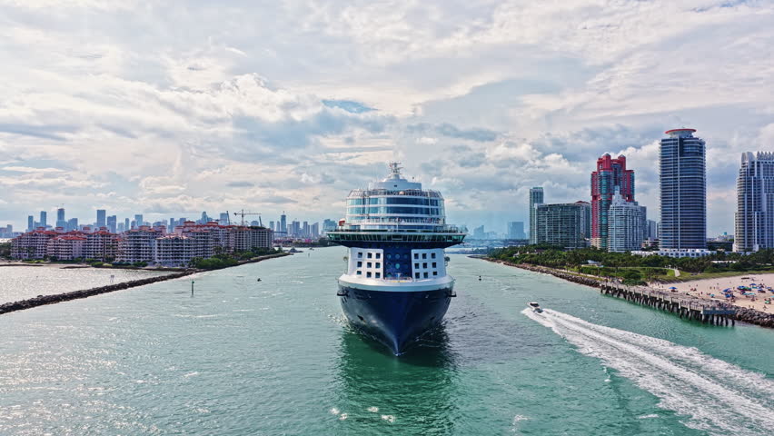 Cruise ship voyage. Aerial view of cruise in summer vacation. Cruise ship tour and travel at sea. Aerial view of luxury liner voyage. Ship leaving Miami beach port. Miami tour.