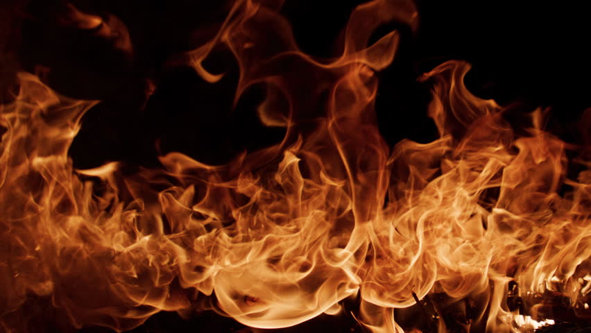 Fire blazing slow motion effect. Fire burning realistic flame shapes. Fire glowing deep contrast. Fire background for editing.