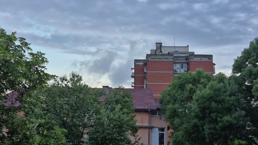 The sky is clearing, the clouds are moving. Dawn, before sunrise, over Belgrade, Serbia.