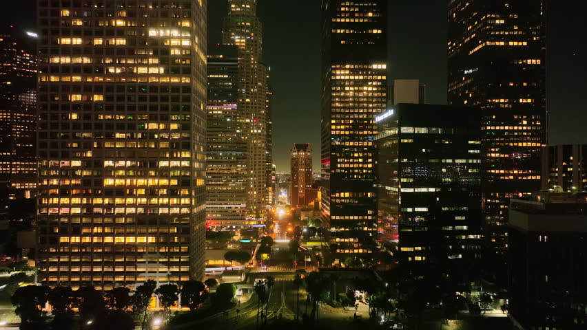 Los Angeles city lights. Los Angeles skyscrapers at night. Night aerial view of LA. Los Angeles downtown night view. Aerial view of Los Angeles skyscrapers at night. LA skyline aerial video.