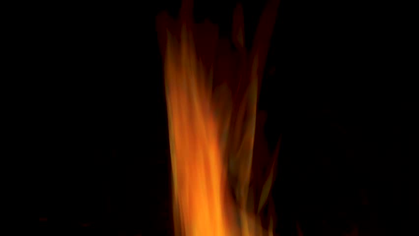 Fire burning in a chimney. Abstract slow motion flames in the dark.