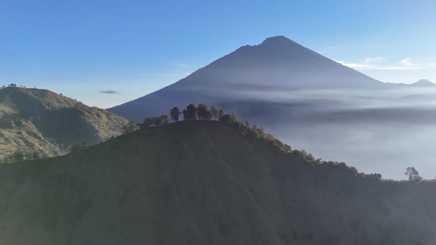 Majestic Mountain Landscape with Morning Mist and Clear Blue Sky
