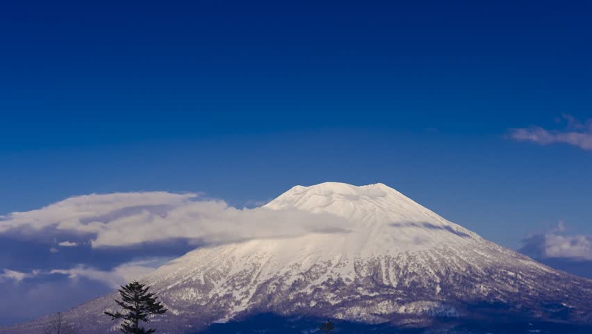 Snow Capped Mount Yotei Ezo Fuji in Winter with Clear Blue Sky Hokkaido Japan Scenic Landscape
