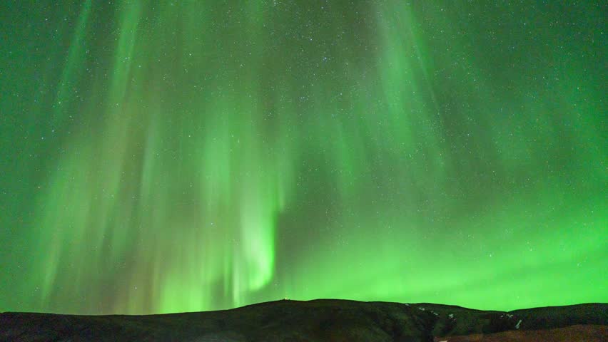 Green Curtain Rays Of Aurora Borealis In South Iceland. - timelapse shot