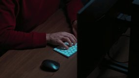 Coder or data scientist in glasses working at dark workspace with multiple monitors. Software engineer types script on keyboard, working on AI development project.  - Powered by Shutterstock - Get 15% off with code: PIKWIZARD15
