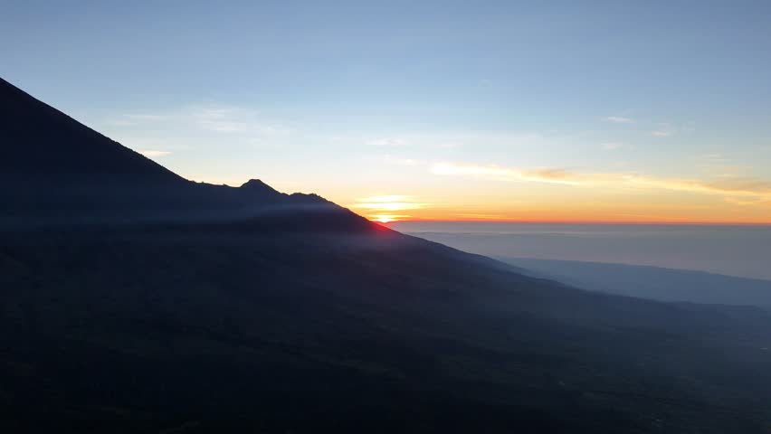 Golden Sunrise Illuminating Mountain Range at Dawn