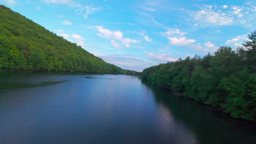 Summer aerial view featuring the Bradley Hubbard Reservoir at Doctor Francis Giuffrida Park and Chauncey Peak in Meriden, Connecticut just before sunset