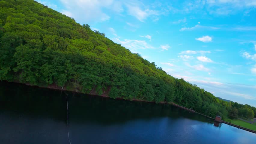 Summer aerial view featuring Chauncey Peak at Doctor Francis Giuffrida Park and the Bradley Hubbard Reservoir in Meriden, Connecticut just before sunset