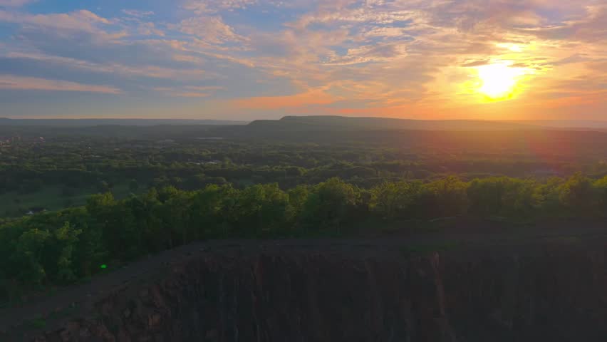 Summer aerial view featuring the Bradley Hubbard Reservoir at Doctor Francis Giuffrida Park and Chauncey Peak in Meriden, Connecticut just before sunset