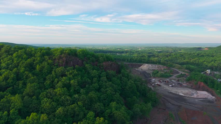 Summer aerial view featuring a quarry in Meriden, Connecticut at sunset
