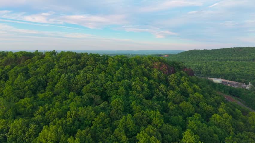 Summer aerial view featuring a quarry in Meriden, Connecticut at sunset