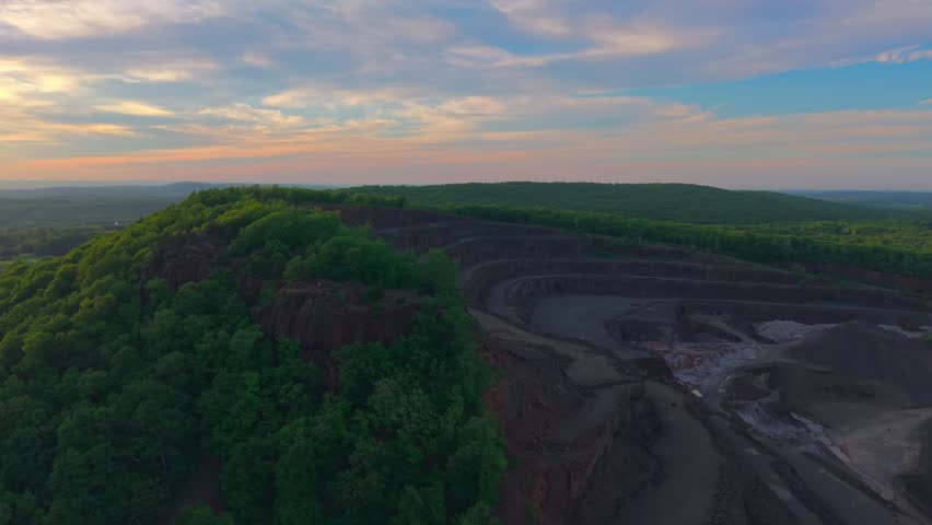 Summer aerial view featuring a quarry in Meriden, Connecticut at sunset