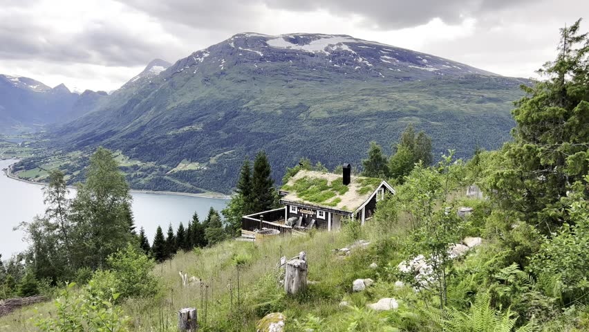 Traditional Norwegian Cabin with Fjord and Mountain View