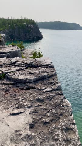 Limestone cliffs and crystal clear water in Bruce Peninsula National Park. Ontario, Canada.