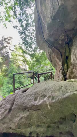 Rocky cliffs surrounded by forest in Blue Mountains.