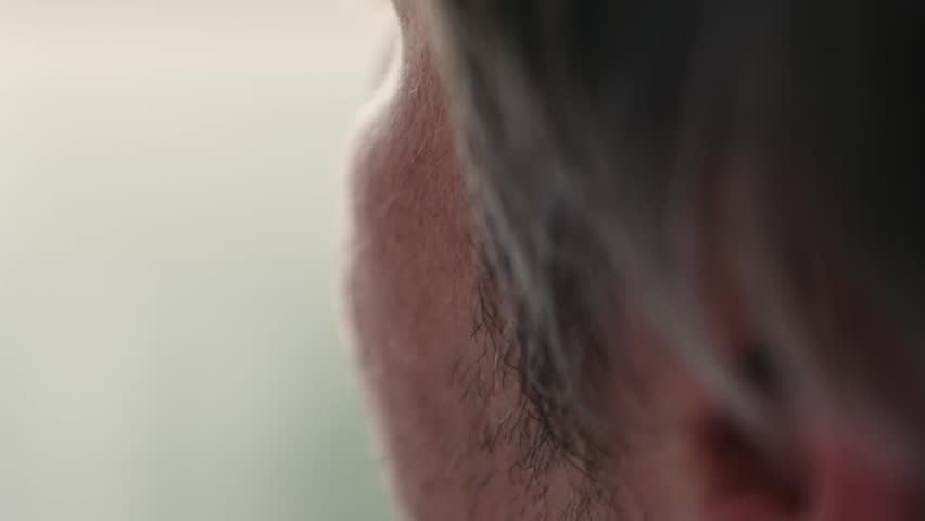 Bearded man drinking beer a refreshing beverage from an aluminum can, close up drink soda