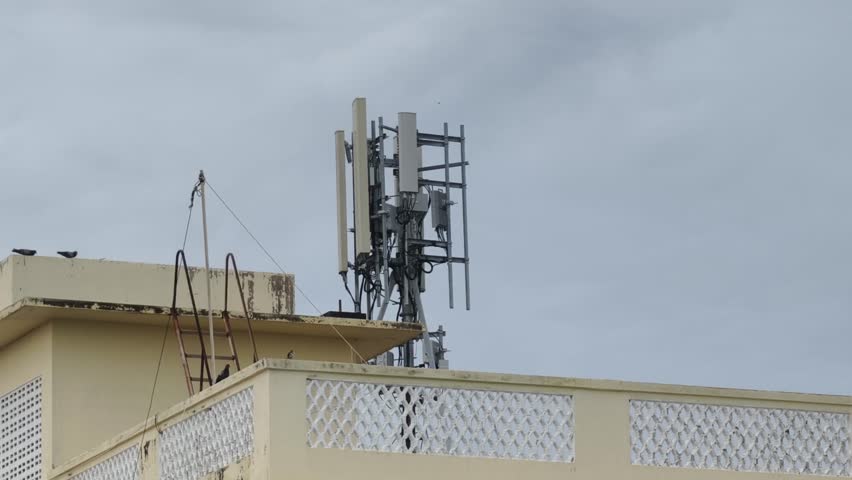 Cellular network antennas mounted on top of a concrete building